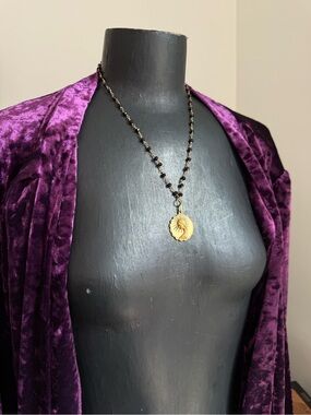 Gold Sunburst Pendant Necklace with Black Beaded Chain